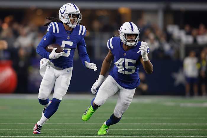 Dec 4, 2022; Arlington, Texas, USA; Indianapolis Colts cornerback Stephon Gilmore (5) returns an interception as linebacker E.J. Speed (45) looks to make a block in the second quarter against the Dallas Cowboys at AT&T Stadium.